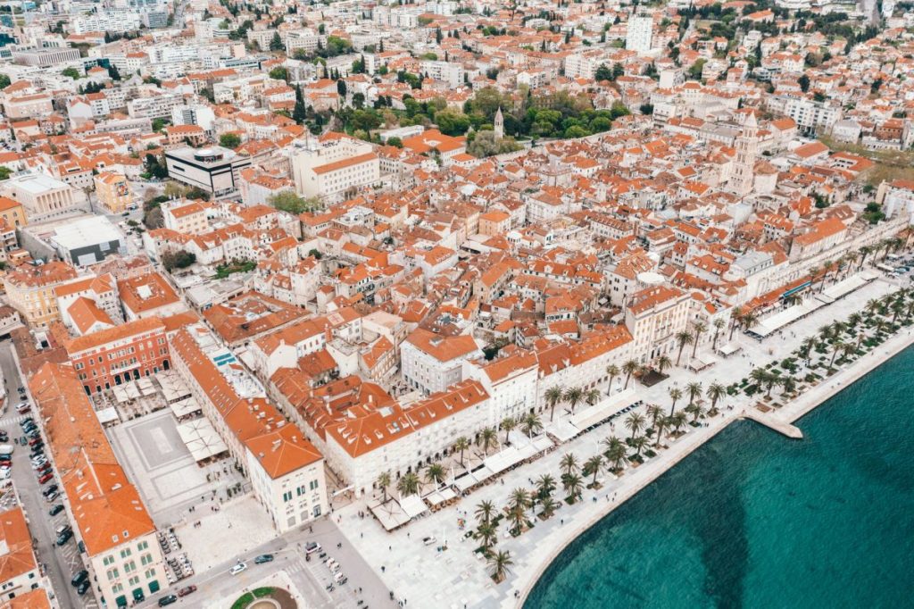 coastal town embankment with red roofed buildings