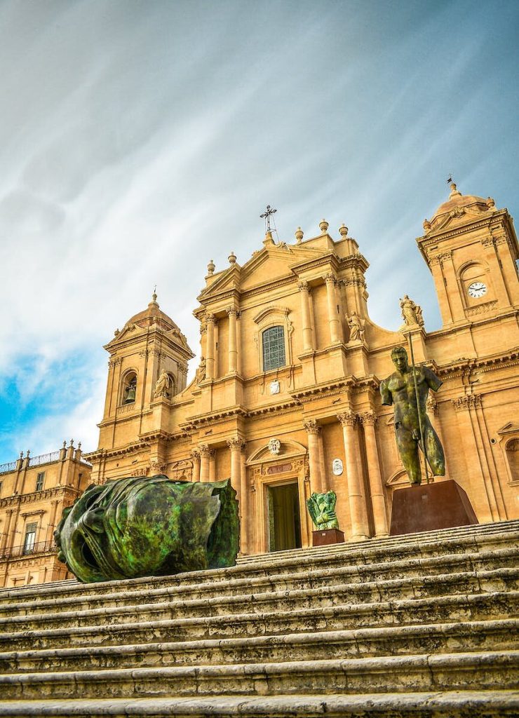 the statues in front of the noto cathedral